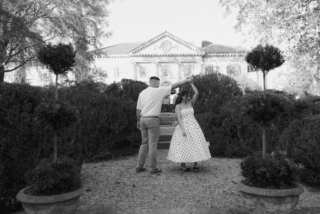 Couple posing in front of the historic estate at Hills & Dales Estate in LaGrange, GA