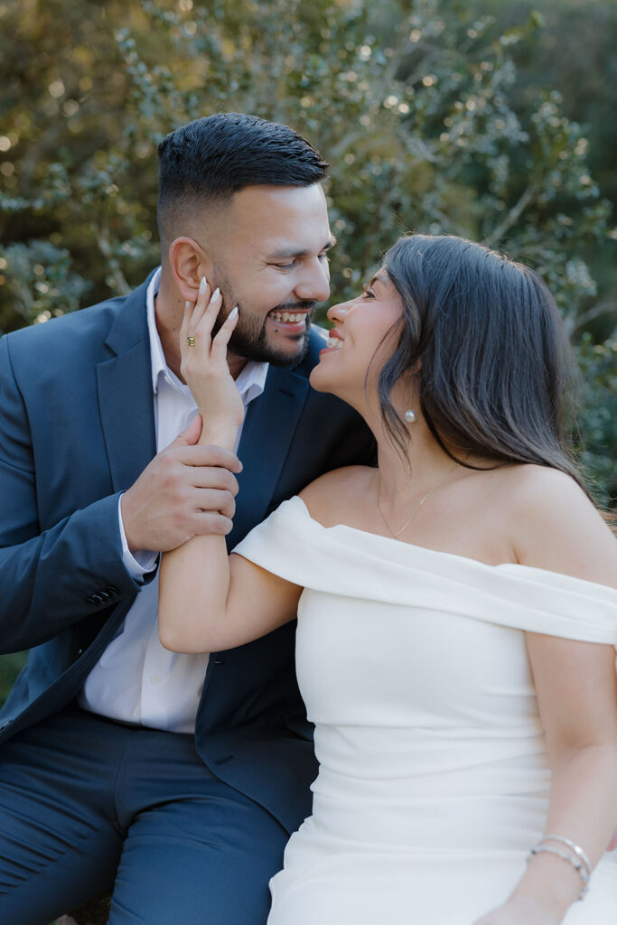Engagement session on garden pathways with lush greenery at Hills & Dales Estate in LaGrange, GA