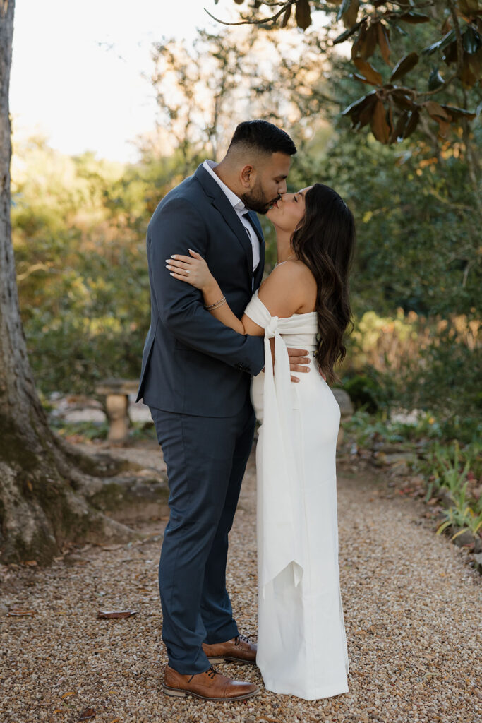 Engagement session on garden pathways with lush greenery at Hills & Dales Estate in LaGrange, GA