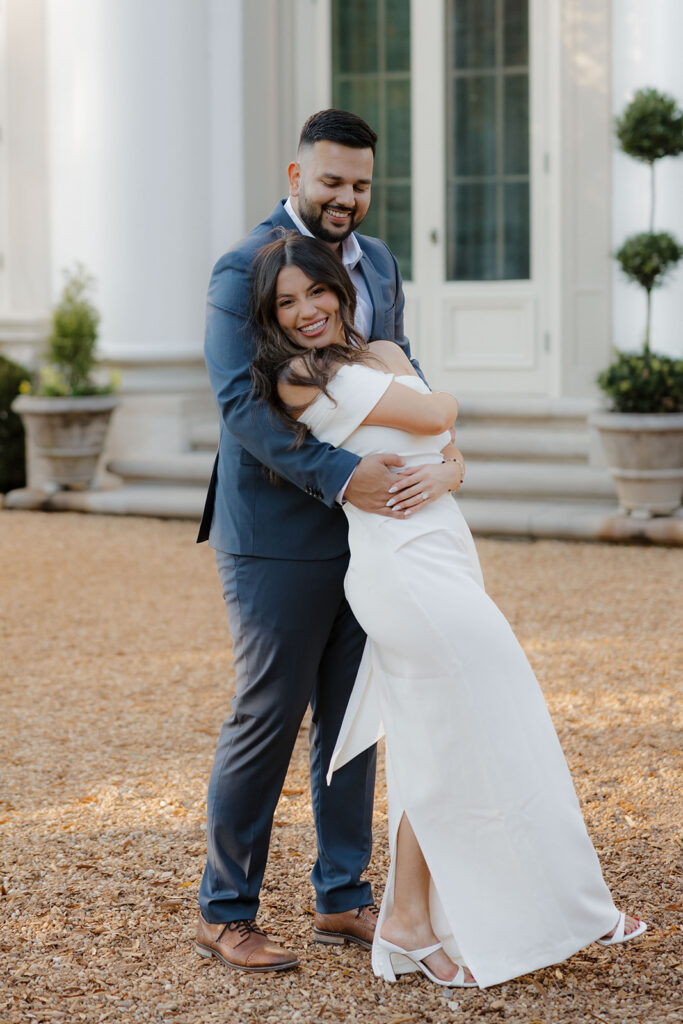 Couple posing in front of the historic estate at Hills & Dales Estate in LaGrange, GA