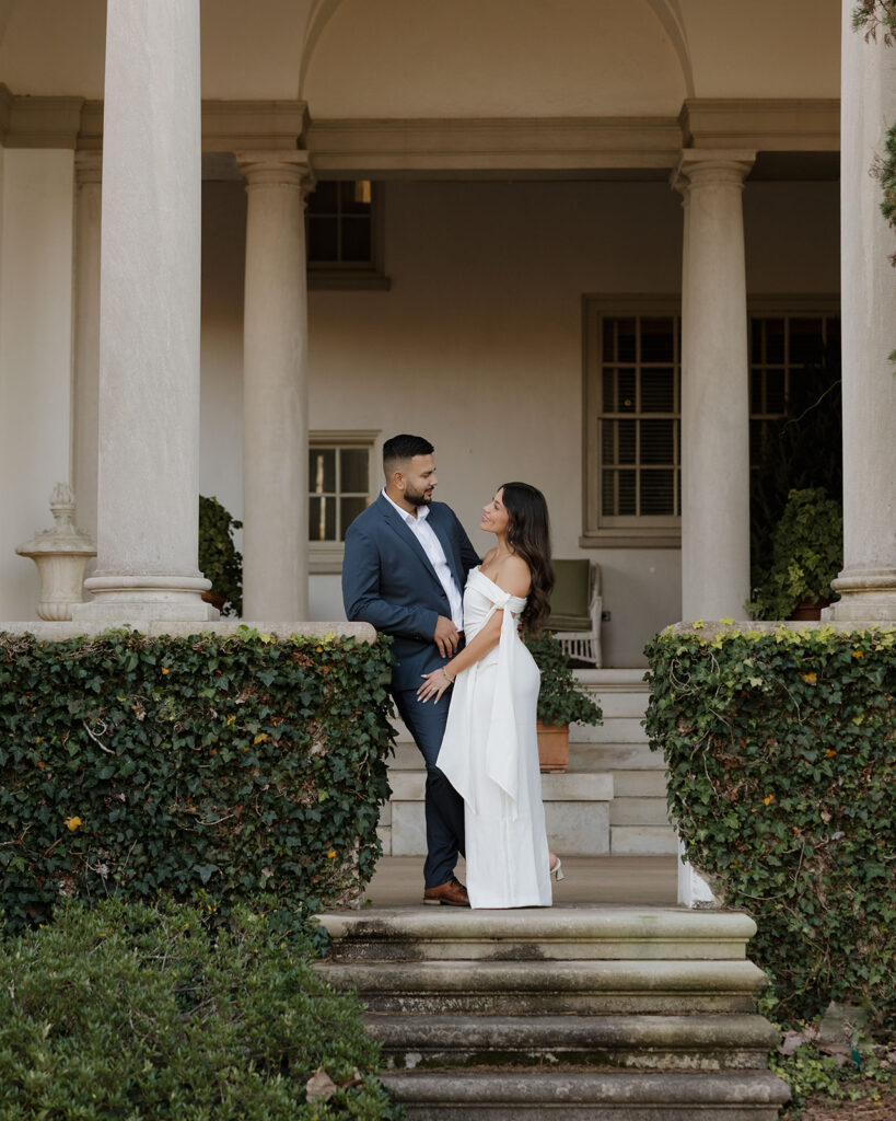 Couple posing in front of the historic estate at Hills & Dales Estate in LaGrange, GA