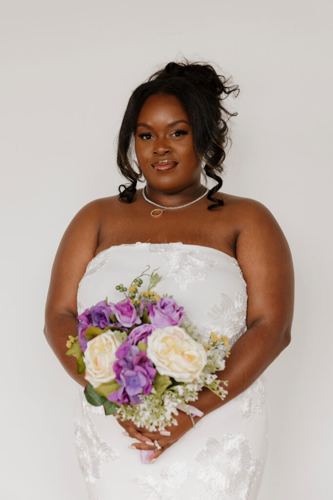 Bridal portraits in natural light studio with sleek wedding dress and shawl