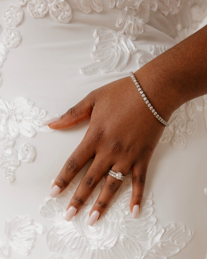 Bridal portraits in natural light studio with sleek wedding dress and shawl