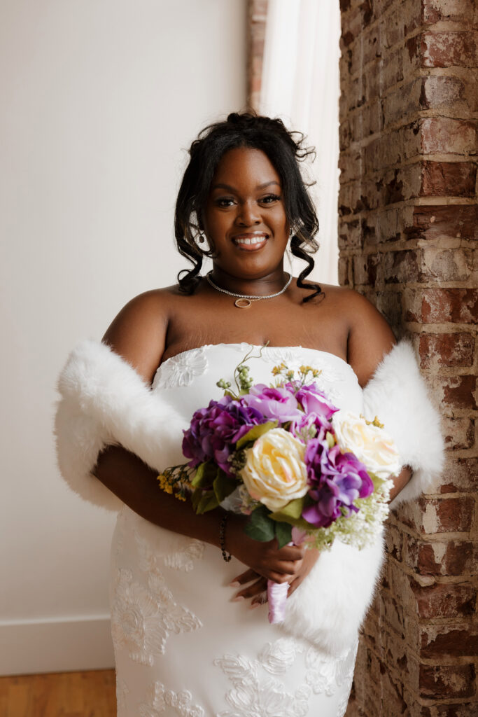 Bridal portraits in natural light studio with sleek wedding dress and shawl