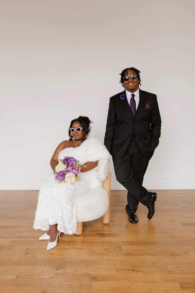 Studio wedding portraits of bride and groom in bright neutral studio space