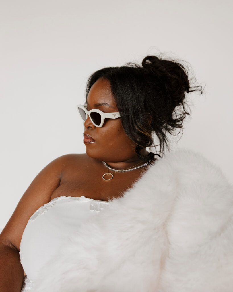 Bridal portraits in natural light studio with sleek wedding dress and shawl