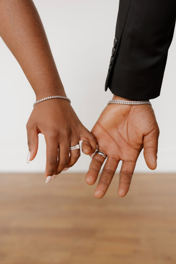 Studio wedding portraits of bride and groom in bright neutral studio space