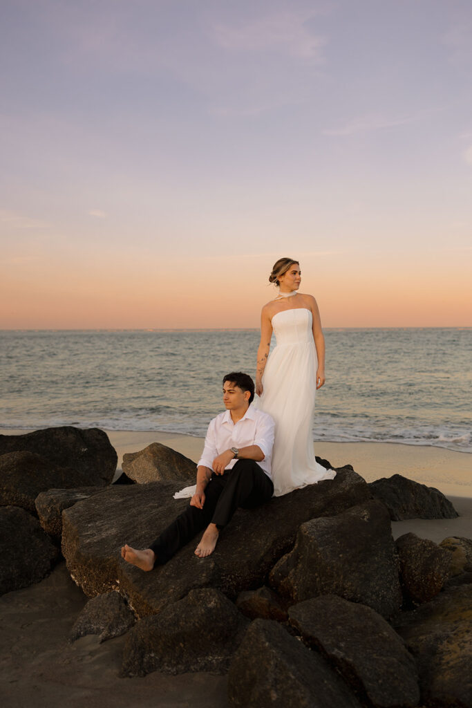 Folly Beach elopement photos at sunset with lighthouse by Leigha Gray Photography