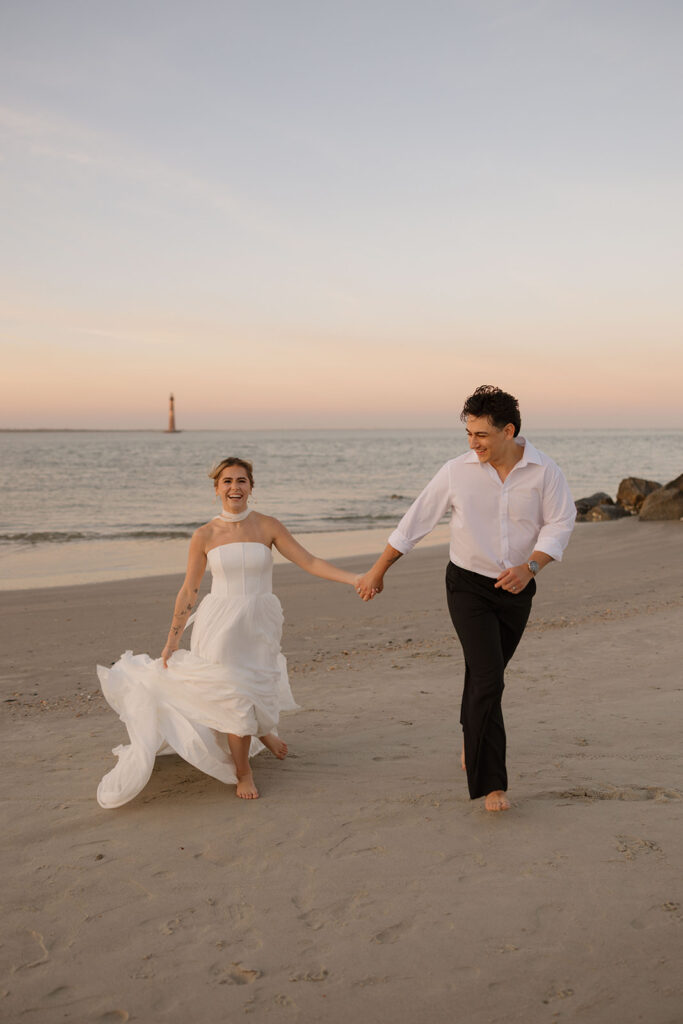 Folly Beach elopement photos at sunset with lighthouse by Leigha Gray Photography